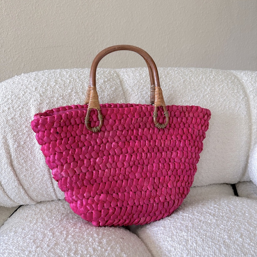 Pink woven handbag